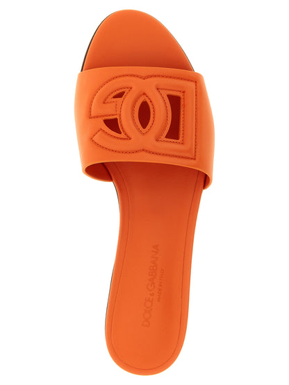 Sliders Flat Shoes by Dolce & Gabbana for women in calfskin leather orange showcases a dynamic silhouette, artfully capturing Women's Calfskin Leather Sliders Flat Shoes through its distinctive and elegant .