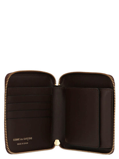 Wallet by Comme Des Garçons for men in leather brown presents a refined silhouette, artfully capturing the essence of the Leather Wallet design with sophisticated for a refined look.