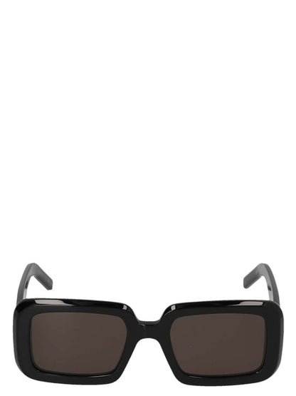 This Sunglasses by Saint Laurent for women in calfskin leather black presents a sumptuous silhouette, showcasing a sumptuous square frame design in black coloured frame and high-performance .