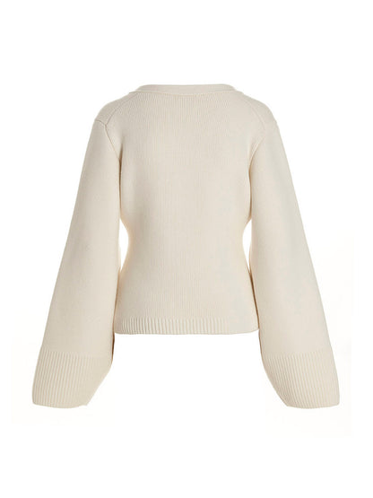Cardigan by Khaite for women in cashmere white presents a textural silhouette, artfully finished with a textural v-neck neckline and for a sophisticated, textural look.