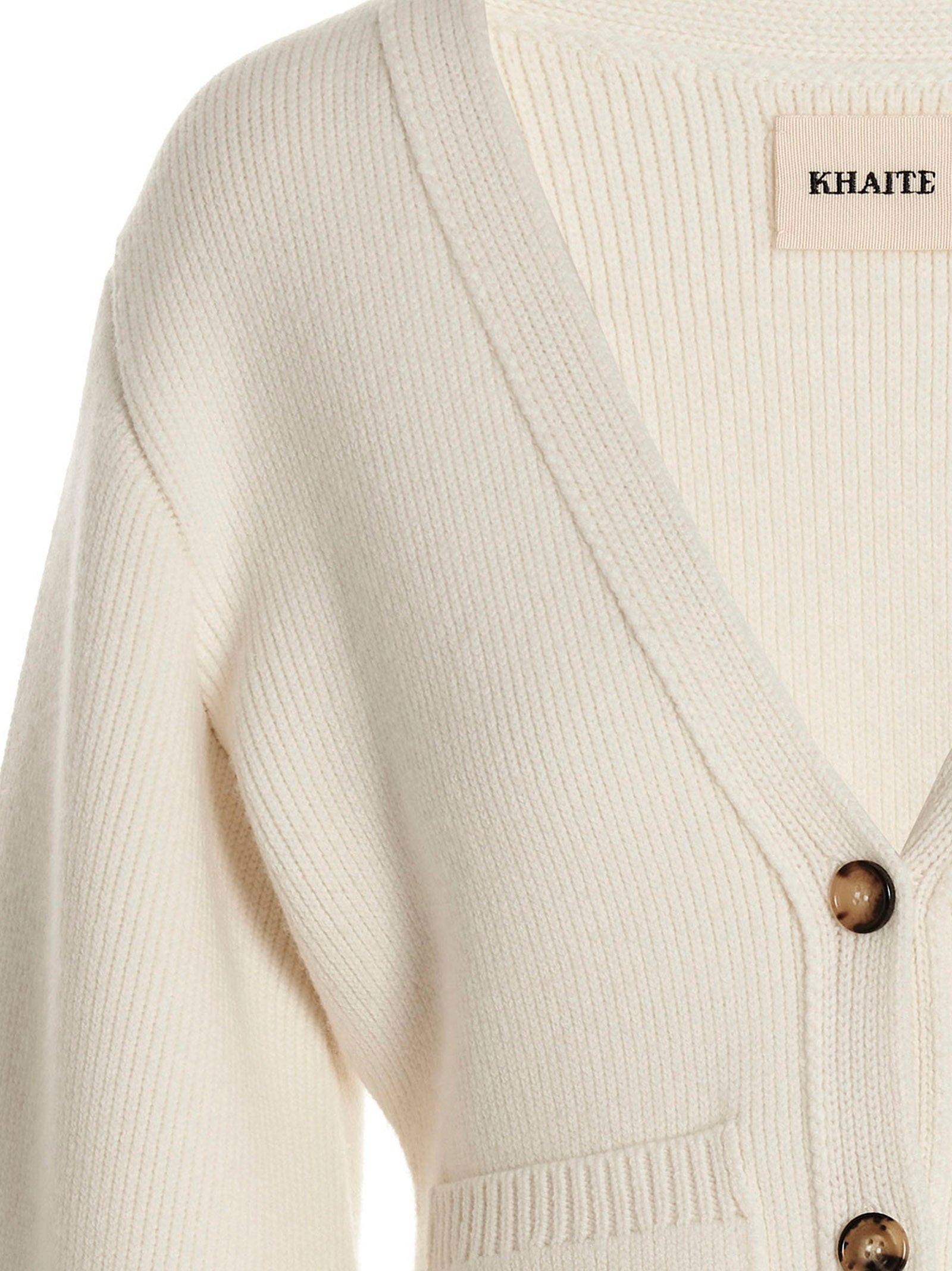 Cardigan by Khaite for women in cashmere white showcases a luxurious silhouette, meticulously detailed with a sophisticated v-neck neckline and for a refined finish.