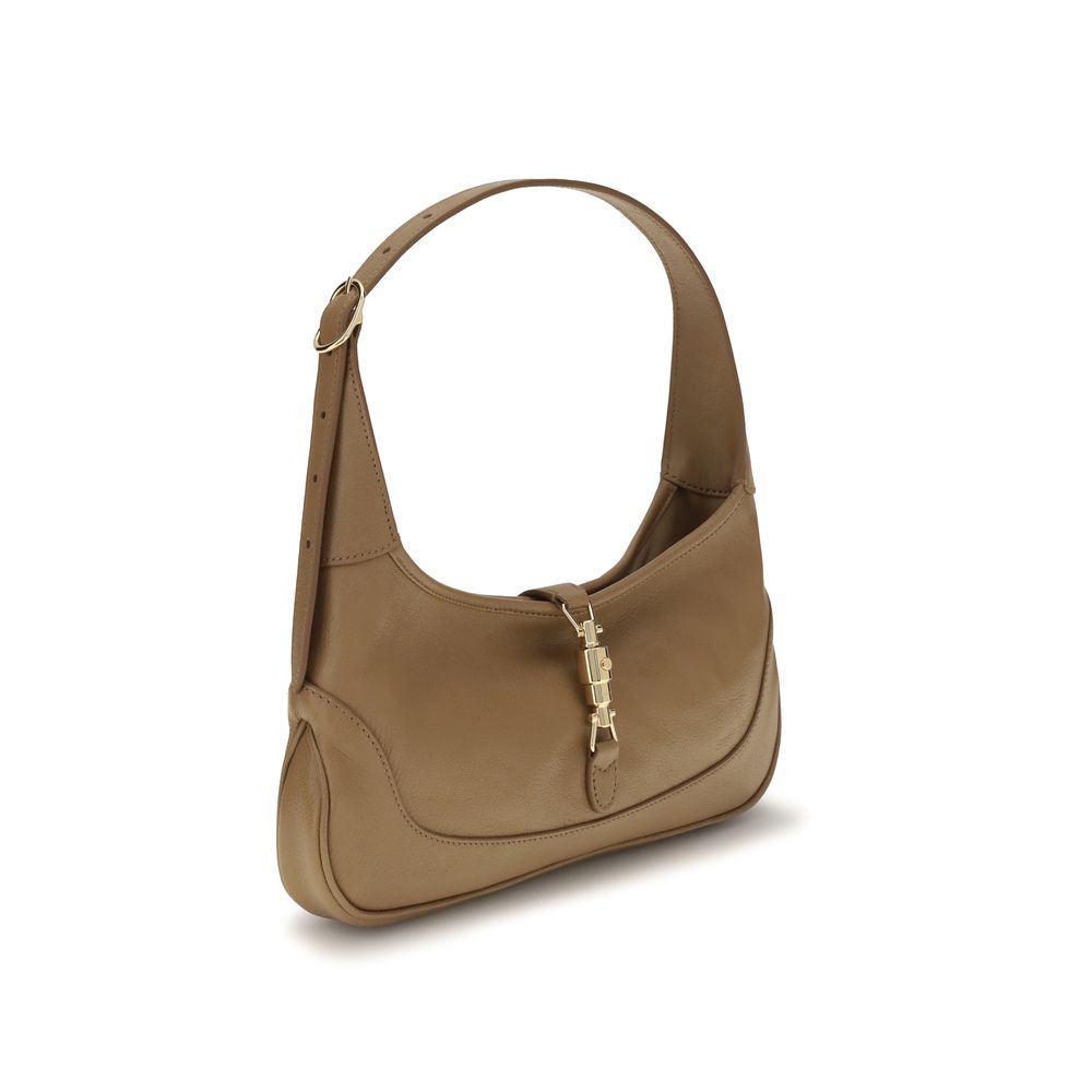 Medium Shoulder Hobo Handbag by Gucci for women in bos taurus calf grained leather beige, gold, natural & signature features an refined silhouette, showcasing a secure zipper, ample , and versatile shoulder-strap & handle for a sophisticated refined aesthetic.