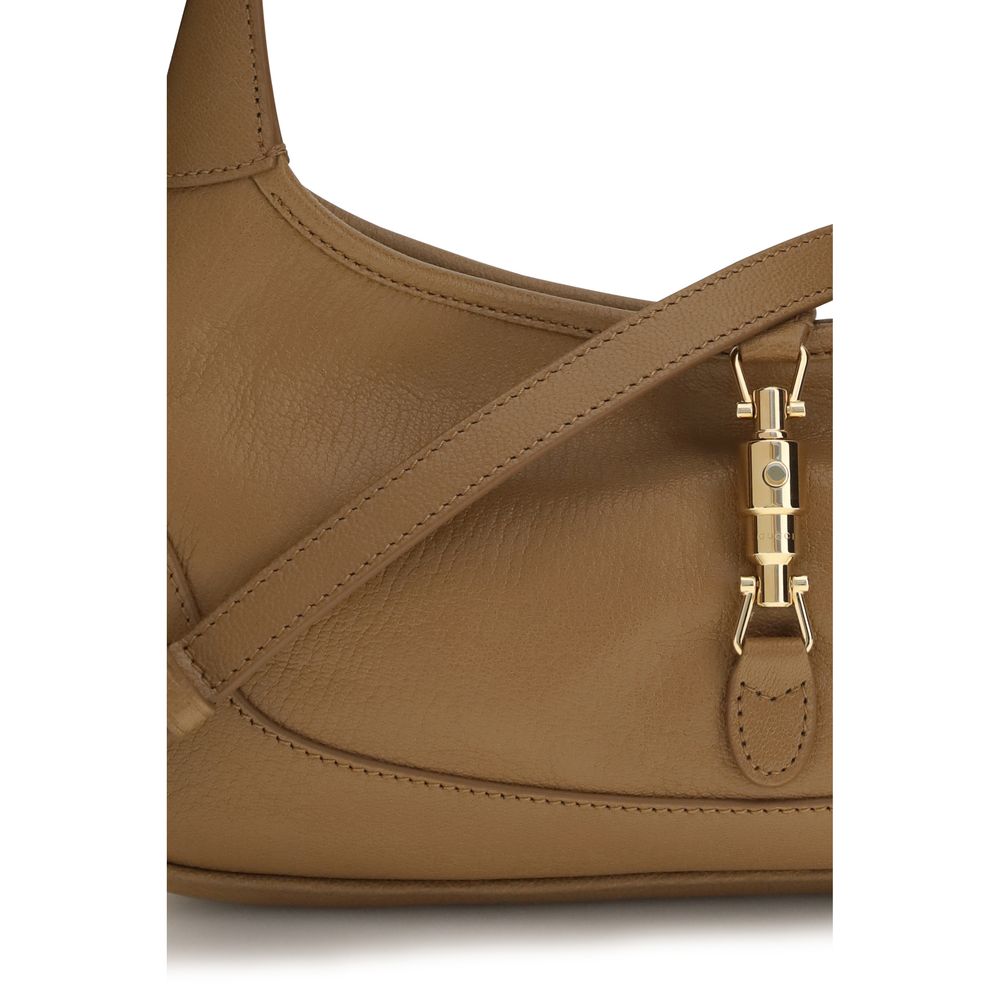 Medium Shoulder Hobo Handbag by Gucci for women in bos taurus calf grained leather beige, gold, natural & signature features a contemporary silhouette, showcasing a secure zipper, ample , and contemporary shoulder-strap & handle for a sophisticated look.
