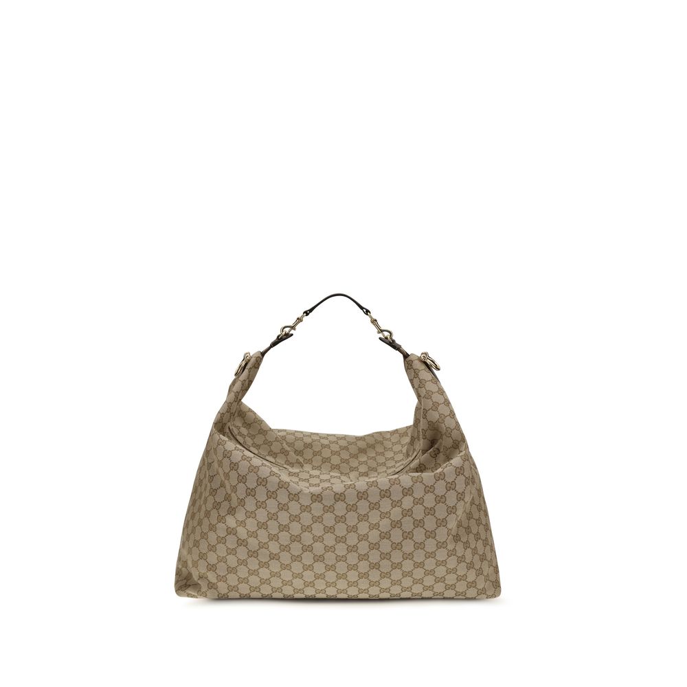 Large Shoulder Bag by Gucci for men in nylon faux leather & canvas beige, gold & signature showcases a enviable silhouette, artfully detailed with a secure zipper, organized , and versatile shoulder-strap, adjustable-strap, detachable-strap & handle for a enviable look.