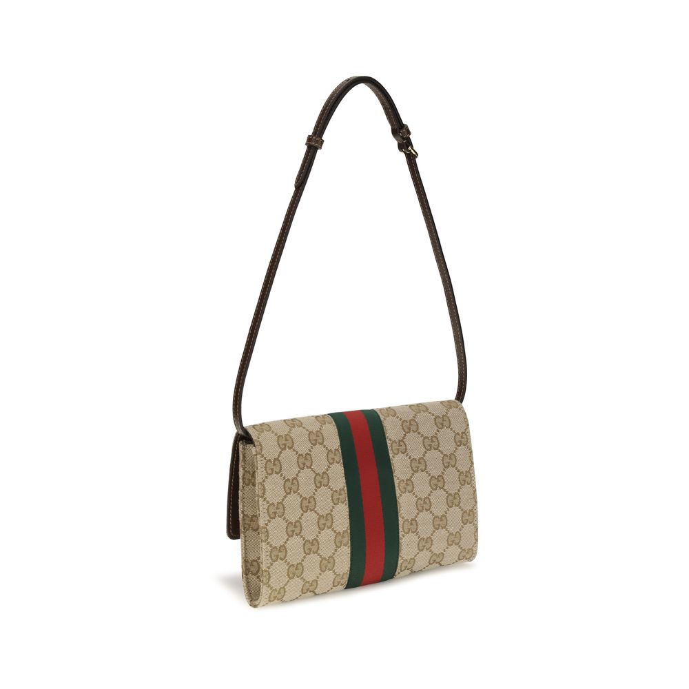 Cardholder Wallet by Gucci for women in polyester leather cotton canvas blue, brown, gold, red, monogram & striped showcases a discerning silhouette, artfully capturing the essence of Gg Horsebit Polyester Leather Cotton Canvas Cardholder Wallet with its functional card-organization compact-design.