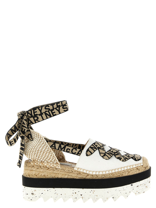 Wedge Sandals by Stella McCartney for women in cotton canvas & raffia beige features an statuesque Women's Cotton Canvas & Raffia Wedge Sandals silhouette with a refined wedge and elegant .