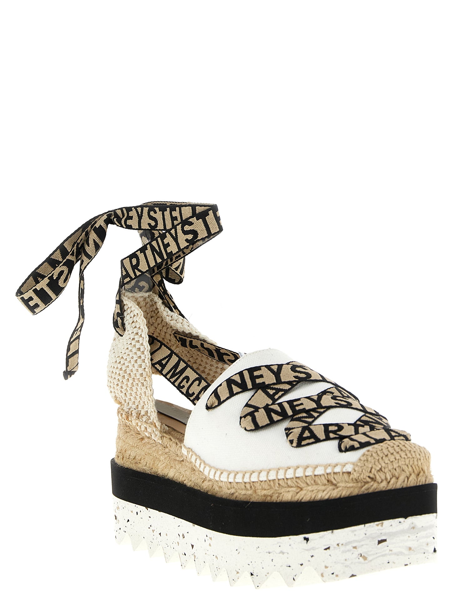 Wedge Sandals by Stella McCartney for women in cotton canvas & raffia beige features an effortlessly chic silhouette from the Women's Cotton Canvas & Raffia Wedge Sandals collection, showcasing a effortlessly chic wedge and elegant .