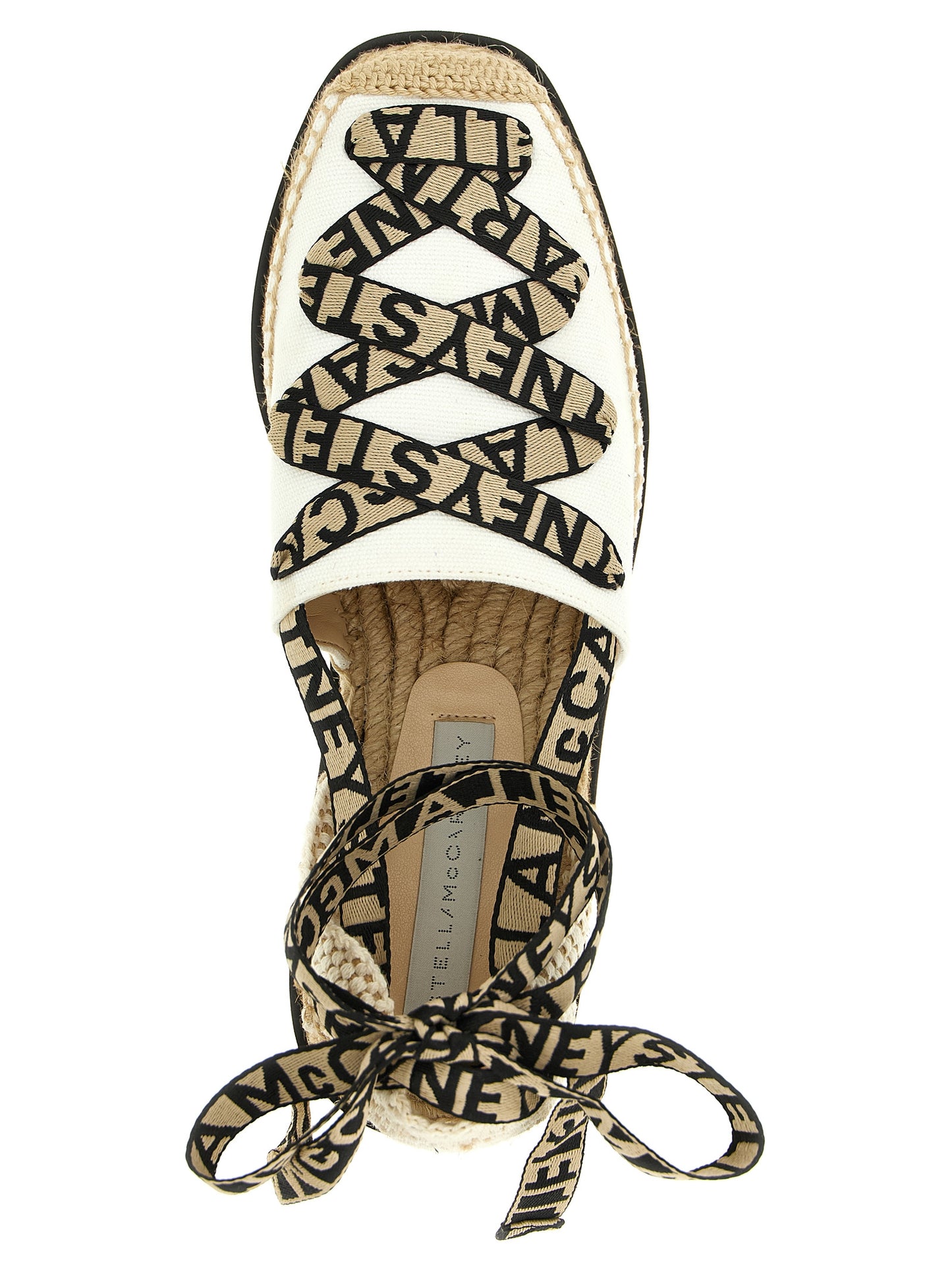 Wedge Sandals by Stella McCartney for women in cotton canvas & raffia beige features an architectural design from the Women's Cotton Canvas & Raffia Wedge Sandals collection, defined by a architectural wedge and for a architectural finish.