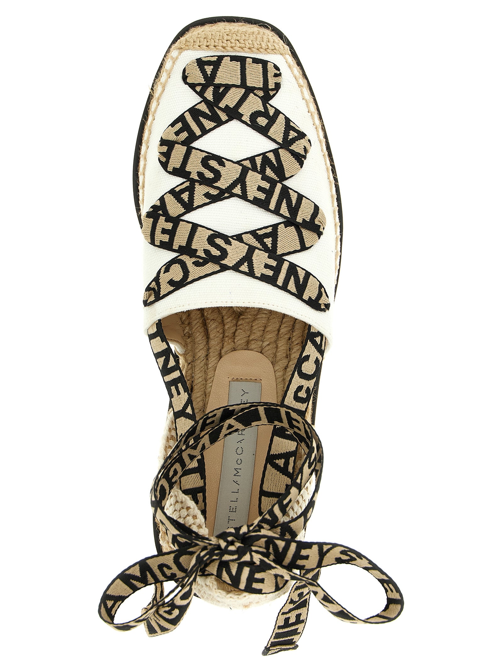 Wedge Sandals by Stella McCartney for women in cotton canvas & raffia beige features an architectural design from the Women's Cotton Canvas & Raffia Wedge Sandals collection, defined by a architectural wedge and for a architectural finish.