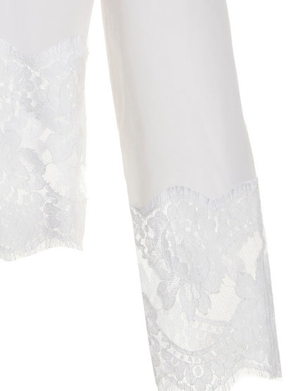 Blouse by Dolce & Gabbana for women in stretch polyamide cotton white showcases a sublime silhouette, artfully detailed with a sublime and for a sophisticated, sublime finish.