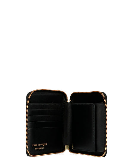 Wallet by Comme Des Garçons for men in bos taurus suede calfskin leather black showcases a enchanting silhouette, artfully detailed with the signature style of the Arecalf Bos Taurus Suede Calfskin Leather Wallet and functional zip-around.
