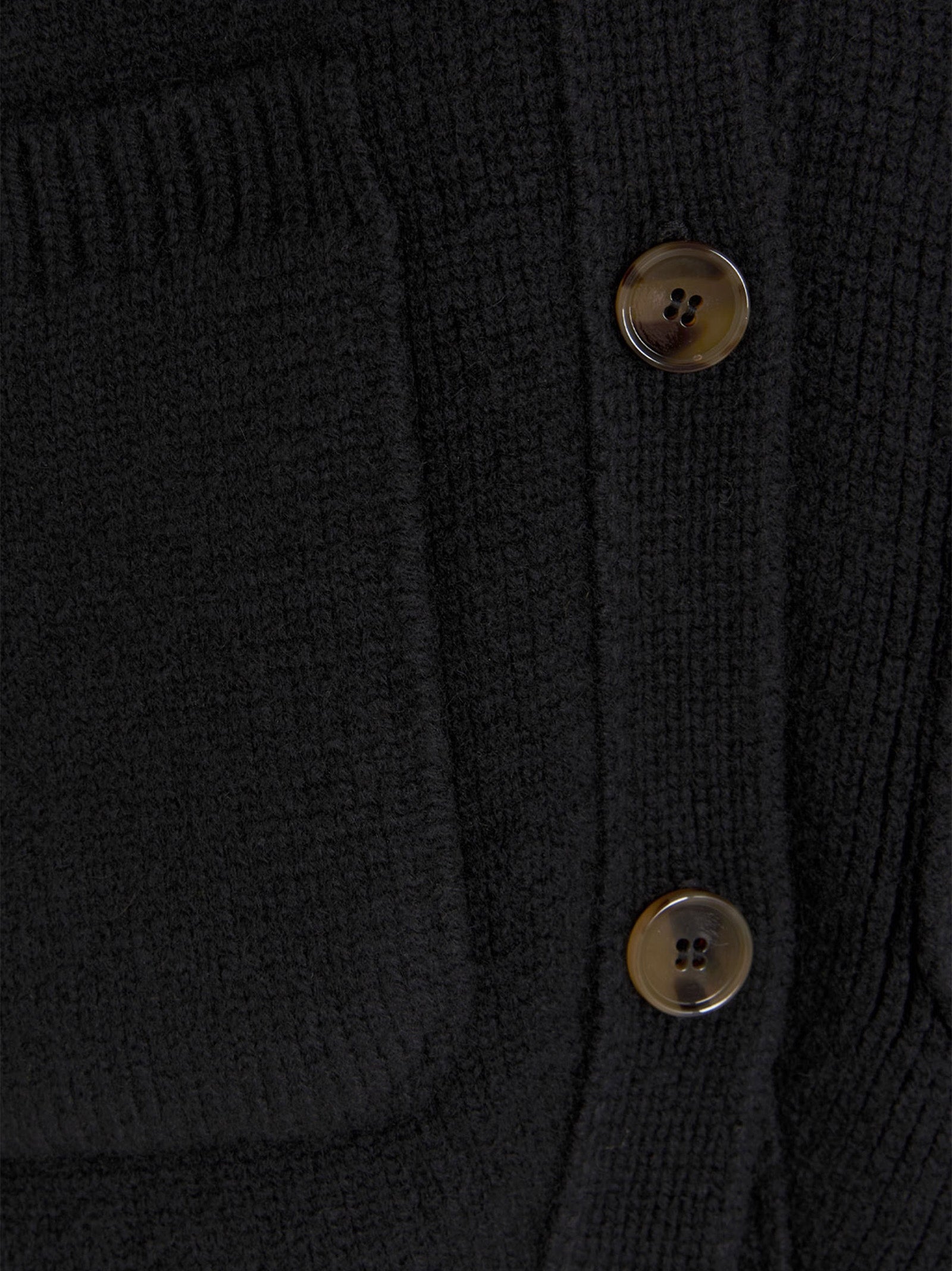 Cardigan by Khaite for women in cashmere black features a dramatic silhouette, showcasing a sophisticated and dramatic detail for a timeless, premium look.
