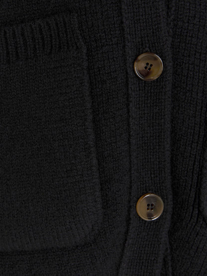 Cardigan by Khaite for women in cashmere black features a dramatic silhouette, showcasing a sophisticated and dramatic detail for a timeless, premium look.