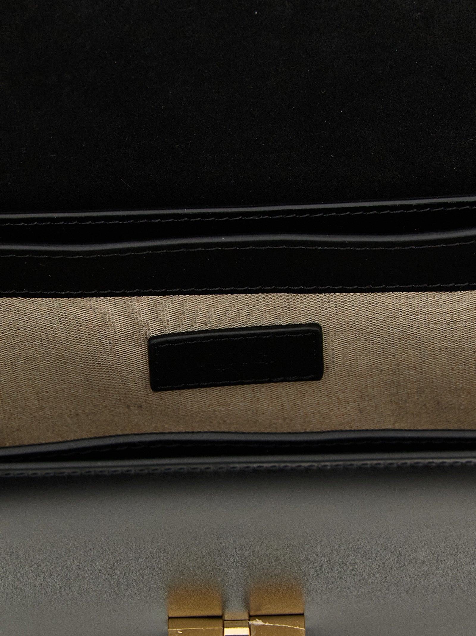 Small Crossbody Flap Handbag by A.P.C. for women in cowhide leather black & gold features a versatile chic silhouette, meticulously detailed with a secure flap, ample , and versatile crossbody-strap, shoulder-strap & adjustable-strap.