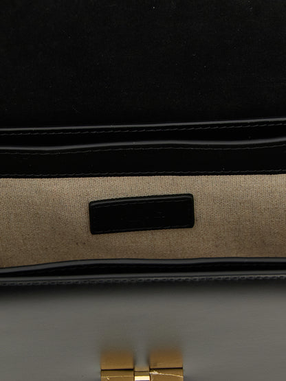 Small Crossbody Flap Handbag by A.P.C. for women in cowhide leather black & gold features a versatile chic silhouette, meticulously detailed with a secure flap, ample , and versatile crossbody-strap, shoulder-strap & adjustable-strap.