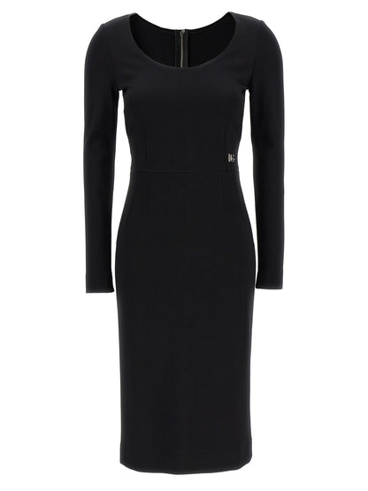Dress by Dolce & Gabbana for women in viscose & polyamide black features a dramatic silhouette, showcasing an elegant round neckline and that flows into a dramatic midi.