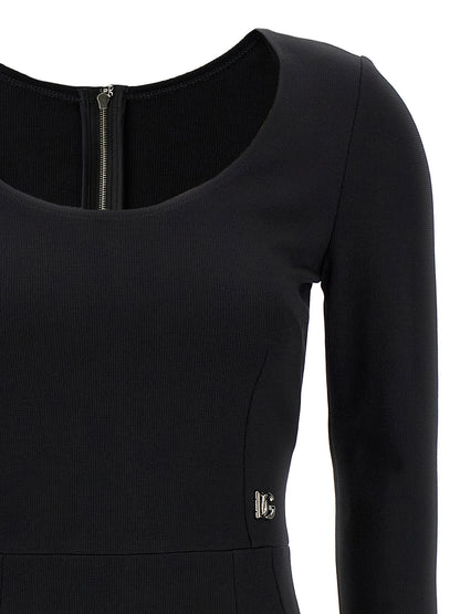 Dress by Dolce & Gabbana for women in viscose & polyamide black features an magnificent silhouette, artfully detailed with a magnificent round neckline and that flows into an magnificent midi.
