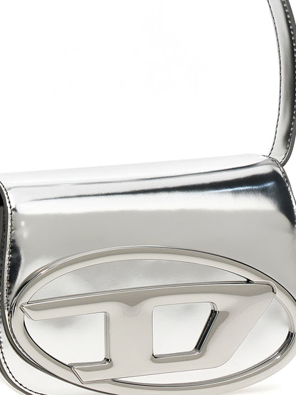 Evening Shoulder Bag by Diesel for women in leather silver & signature showcases a enviable silhouette, artfully detailed with a secure flap, organized , and versatile shoulder-strap & adjustable-strap for a enviable look.
