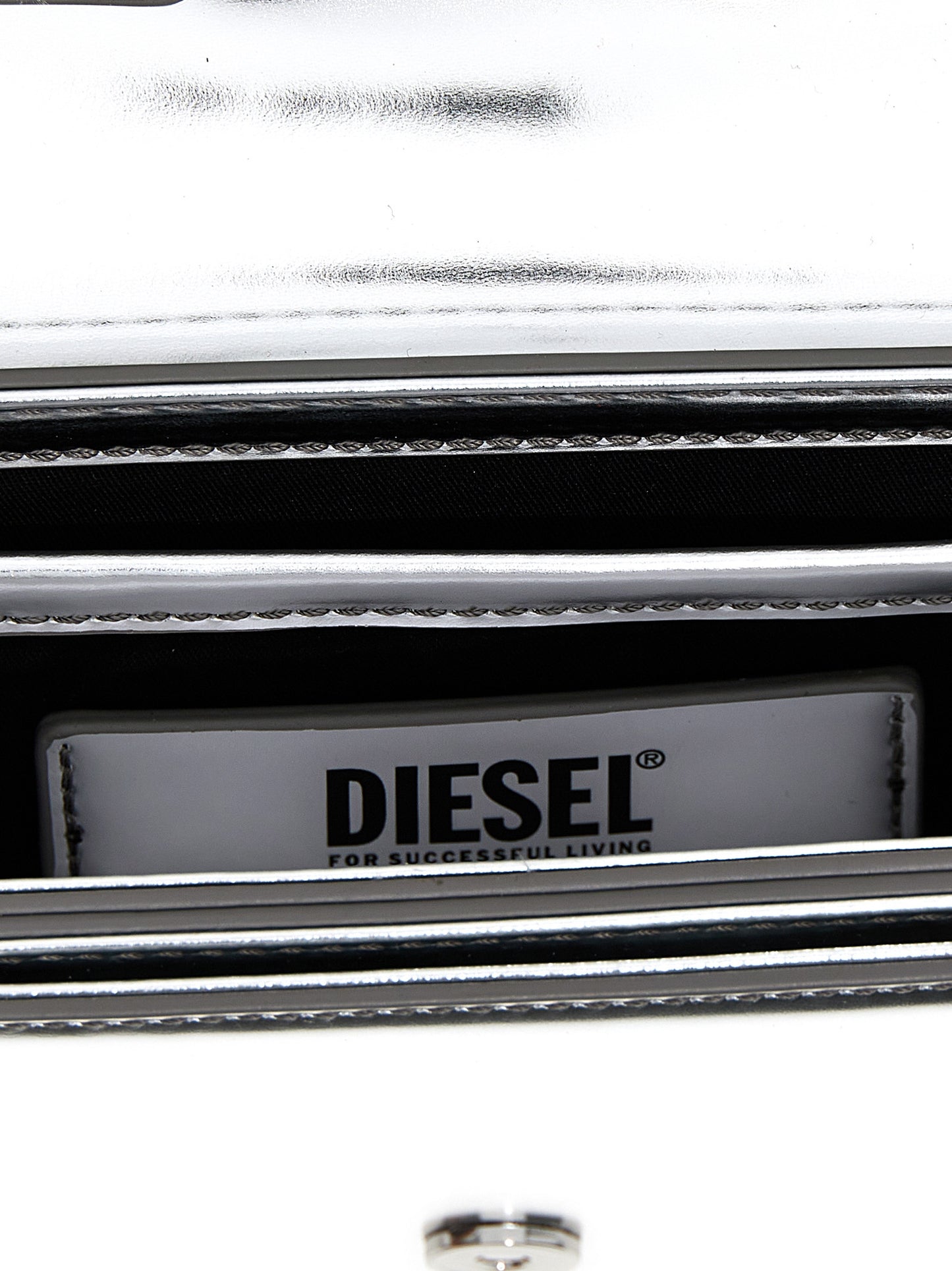 Evening Shoulder Bag by Diesel for women in leather silver & signature features a effortless chic silhouette with a secure flap, ample , and versatile shoulder-strap & adjustable-strap for a effortless chic finish.