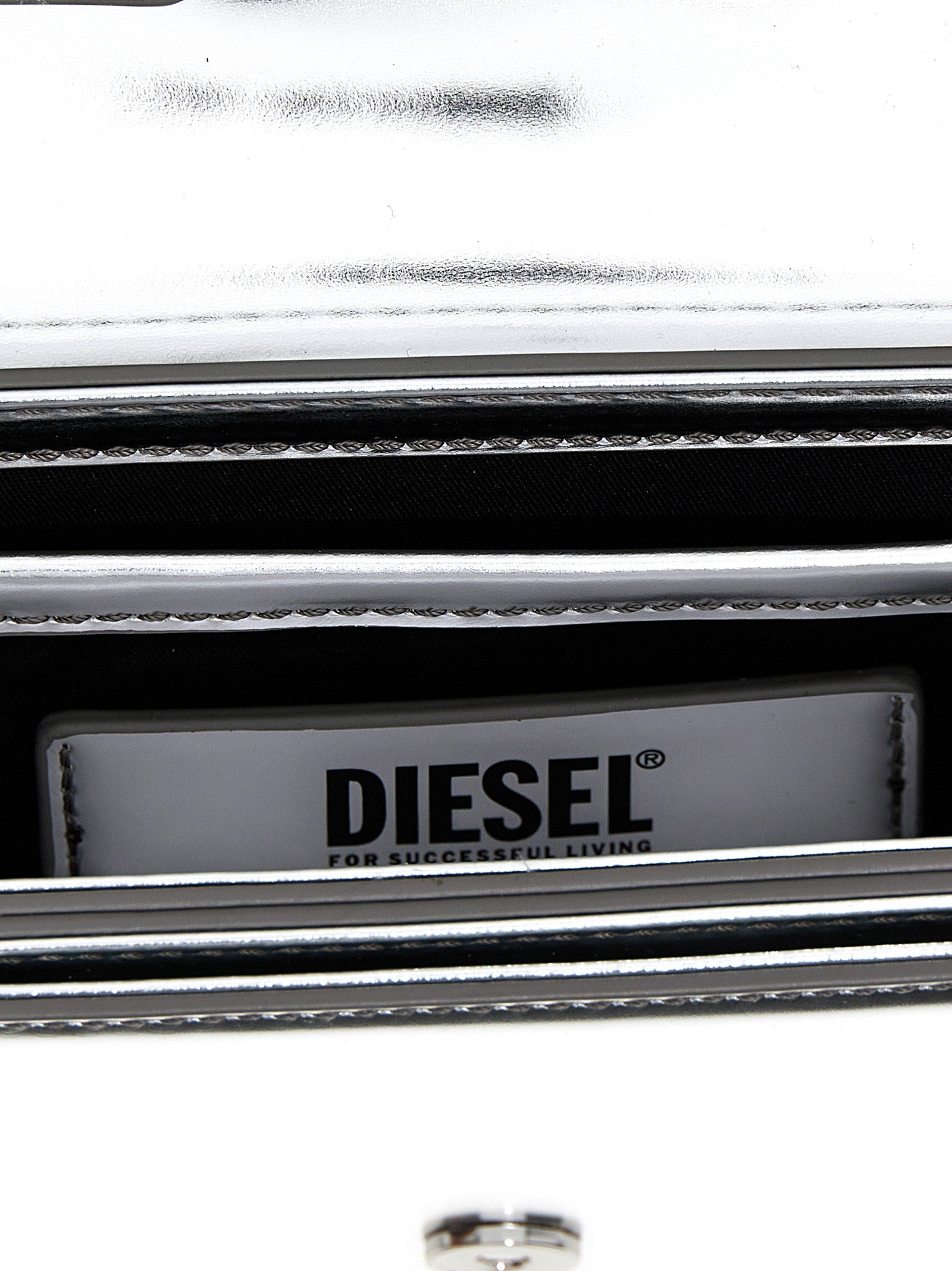 Evening Shoulder Bag by Diesel for women in leather silver & signature features a effortless chic silhouette with a secure flap, ample , and versatile shoulder-strap & adjustable-strap for a effortless chic finish.