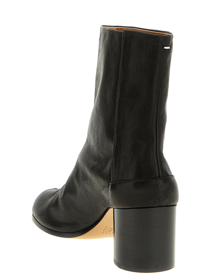 Ankle Boots by Maison Margiela for women in bos taurus calf nappa leather black & signature features an enchanting design from the Essence Women's Bos Taurus Calf Nappa Leather Ankle Boots collection, highlighting a enchanting and for a refined look.