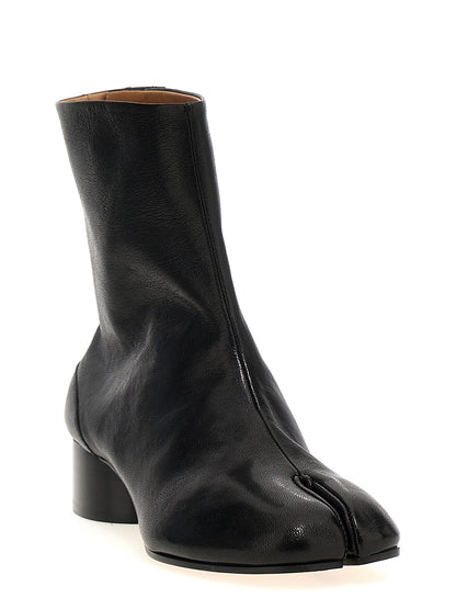 Ankle Boots by Maison Margiela for women in lamb leather black & signature showcases a ergonomic silhouette from the Women's Lamb Leather Ankle Boots collection, featuring a ergonomic and a ergonomic .