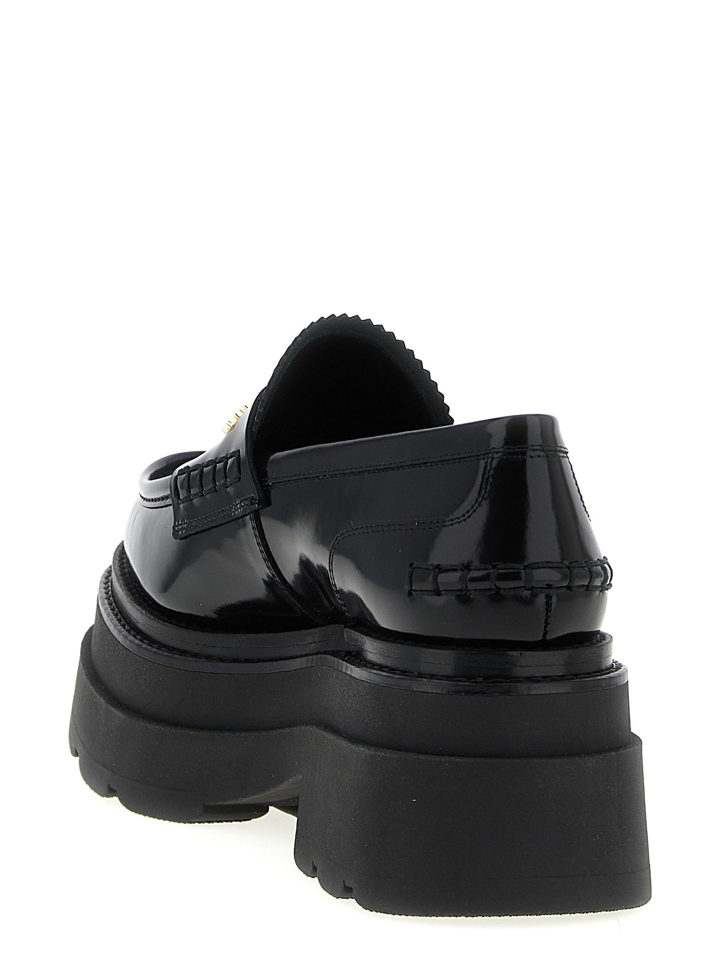 Platform Loafer Shoes by Alexander Wang for women in cowhide leather black features an effortless chic silhouette, showcasing the Women's Cowhide Leather Platform Loafer Shoes design with an effortless chic platform and a for a effortless chic look.