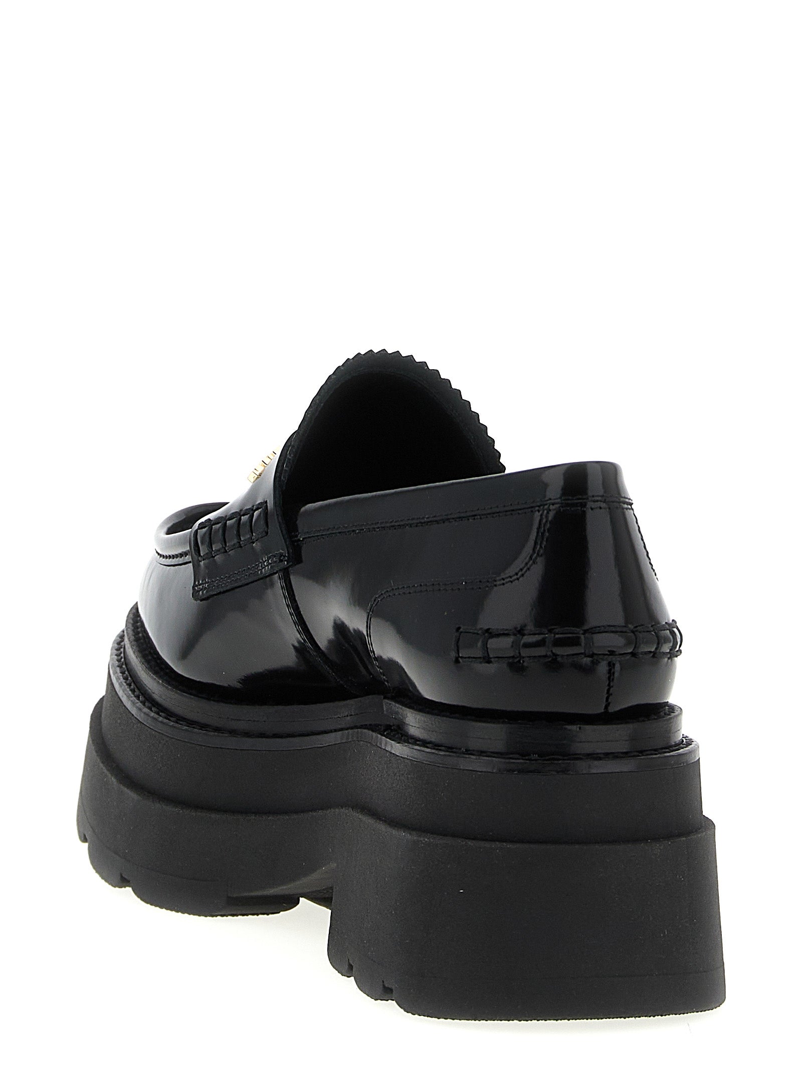 Platform Loafer Shoes by Alexander Wang for women in cowhide leather black features an effortless chic silhouette, showcasing the Women's Cowhide Leather Platform Loafer Shoes design with an effortless chic platform and a for a effortless chic look.