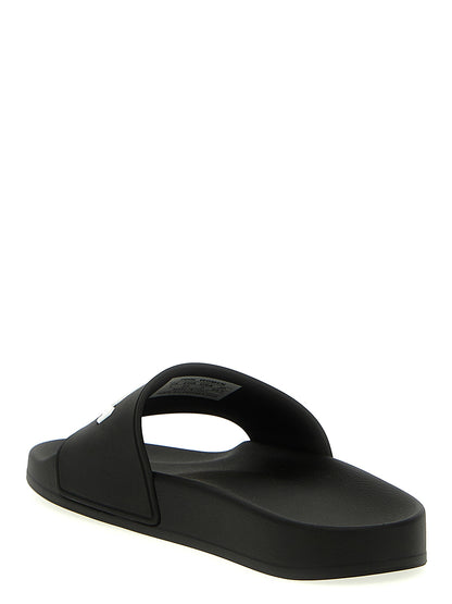 Sliders Sandals Flat Shoes by Balenciaga for women in thermoplastic polyurethane bicolour, black & white showcases a dynamic silhouette, artfully capturing Women's Thermoplastic Polyurethane Sliders Sandals Flat Shoes through its distinctive and elegant .
