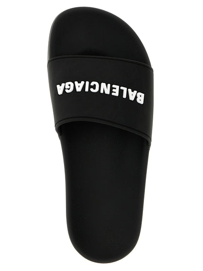 Sliders Sandals Flat Shoes by Balenciaga for women in thermoplastic polyurethane bicolour, black & white presents a effortless chic silhouette, showcasing the Women's Thermoplastic Polyurethane Sliders Sandals Flat Shoes design with a effortless chic and for a sophisticated look.