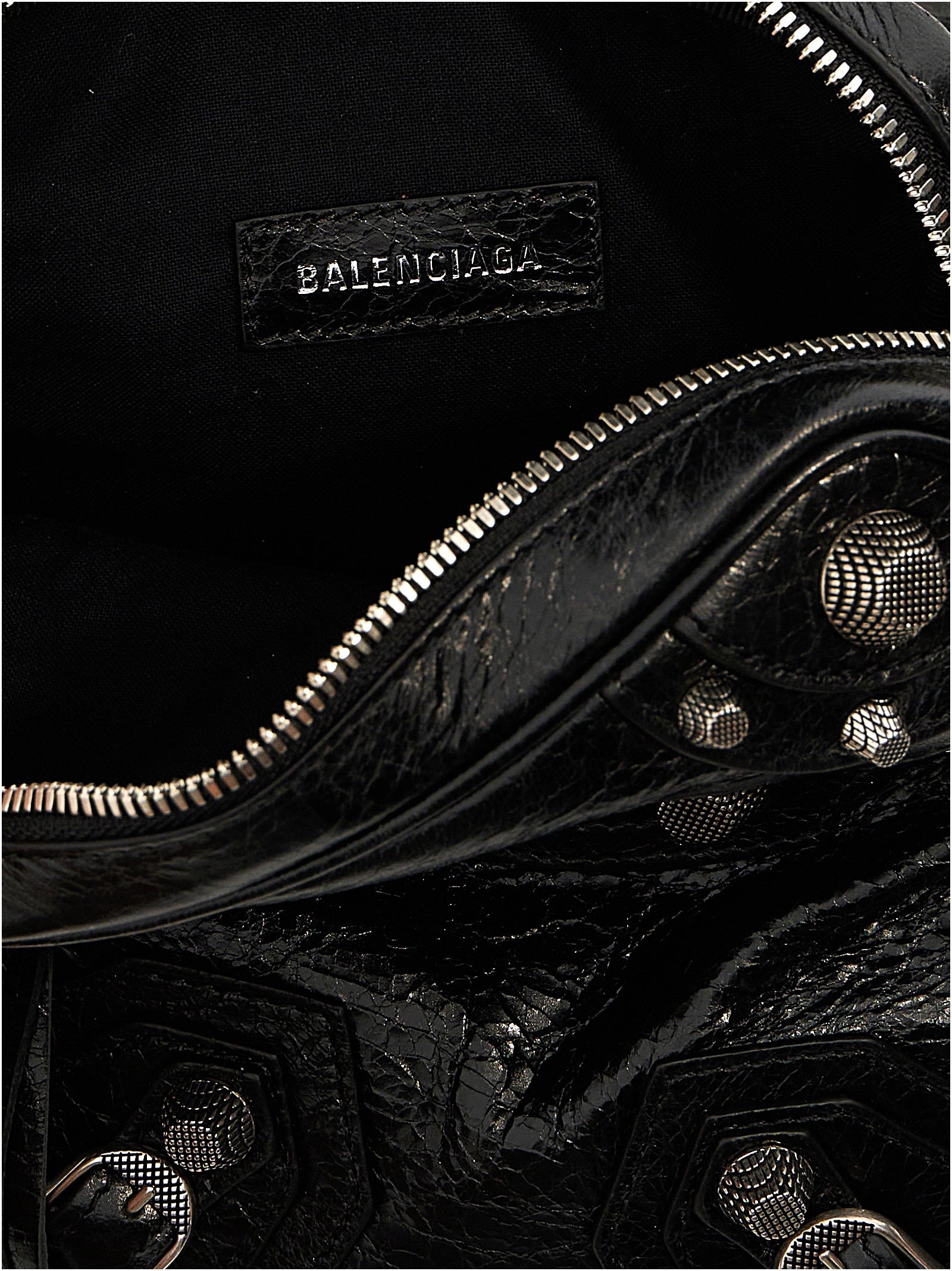Crossbody Messenger Clutch Bag by Balenciaga for men in polyester & lamb leather black showcases a stylish Le Cagole Polyester & Lamb Leather Crossbody Messenger Clutch Bag design, featuring a secure zipper and ample with versatile crossbody-strap, shoulder-strap & adjustable-strap for a stylish look.