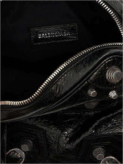 Crossbody Messenger Clutch Bag by Balenciaga for men in polyester & lamb leather black showcases a stylish Le Cagole Polyester & Lamb Leather Crossbody Messenger Clutch Bag design, featuring a secure zipper and ample with versatile crossbody-strap, shoulder-strap & adjustable-strap for a stylish look.
