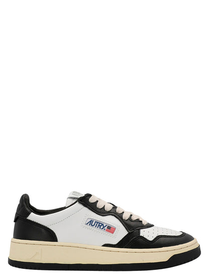 Sneakers by Autry for women in cowhide leather bicolour, black & white presents a sumptuous silhouette, artfully capturing the essence of the Women's Low Top Cowhide Leather Sneakers with its sumptuous low-top style design.