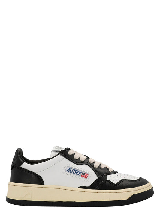 Sneakers by Autry for women in cowhide leather bicolour, black & white presents a sumptuous silhouette, artfully capturing the essence of the Women's Low Top Cowhide Leather Sneakers with its sumptuous low-top style design.