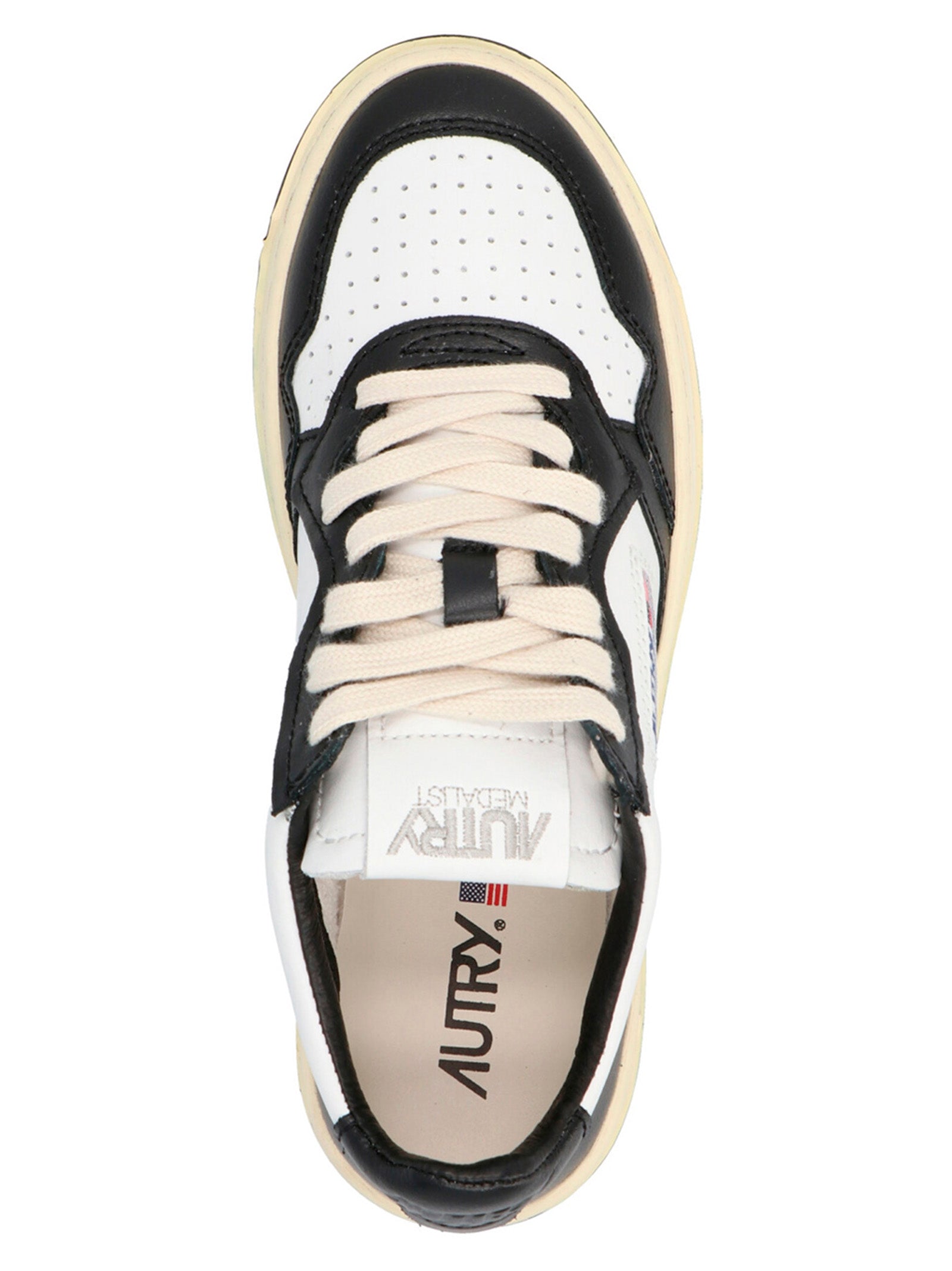 Sneakers by Autry for women in cowhide leather bicolour, black & white presents a on trend silhouette from the Women's Low Top Cowhide Leather Sneakers collection, showcasing a on trend low-top style for an elevated aesthetic.