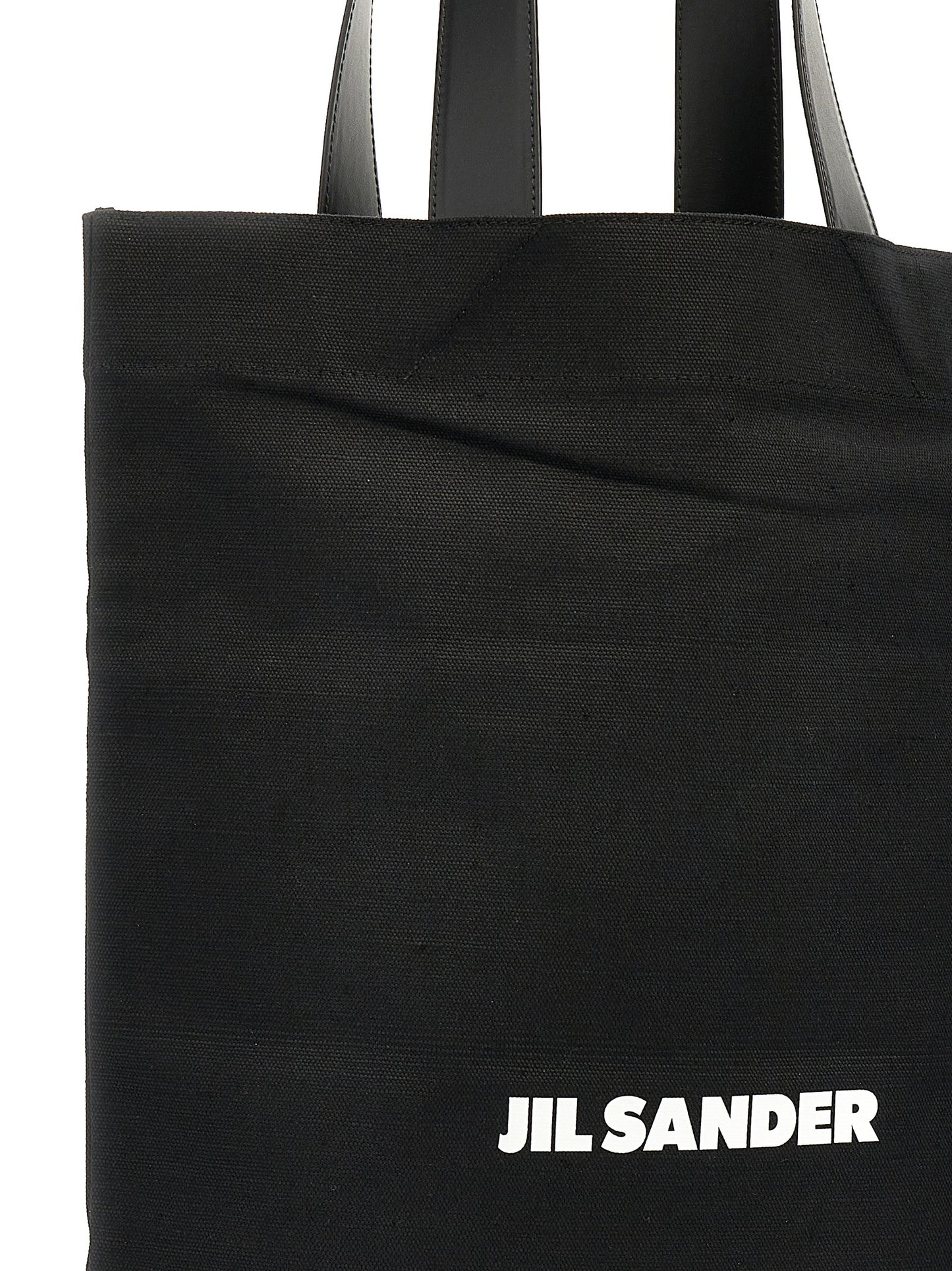 Large Shopper Tote Bag by Jil Sander for women in linen poly cotton canvas & leather black & print features a distinguished Linen Poly Cotton Canvas & Leather Large Shopper Tote Bag design, complete with a secure , ample , and versatile handle for a distinguished look.