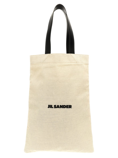 Large Shopper Tote Bag by Jil Sander for women in linen poly cotton canvas & leather bicolour, black, white & print features an utilitarian-chic silhouette, showcasing the City Linen Poly Cotton Canvas & Leather Large Shopper Tote Bag design with a secure , ample , and versatile handle.