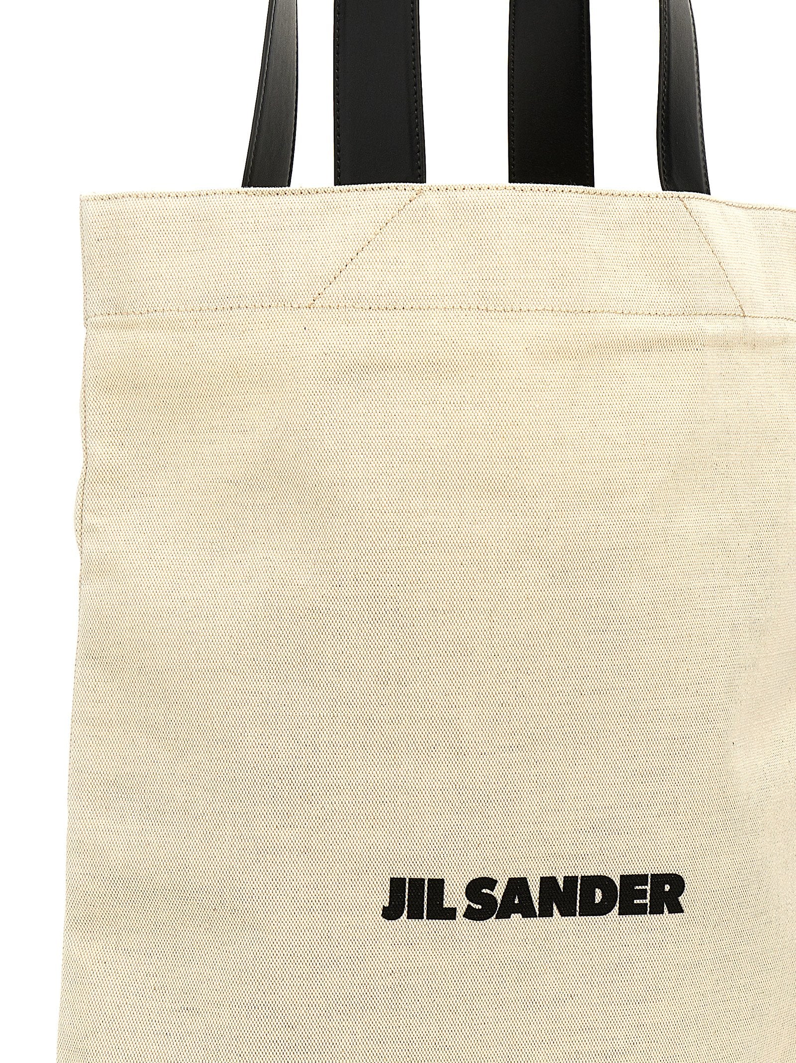 Large Shopper Tote Bag by Jil Sander for women in linen poly cotton canvas & leather bicolour, black, white & print features an sumptuous City Linen Poly Cotton Canvas & Leather Large Shopper Tote Bag design with a secure , ample , and versatile handle for an sumptuous finish.