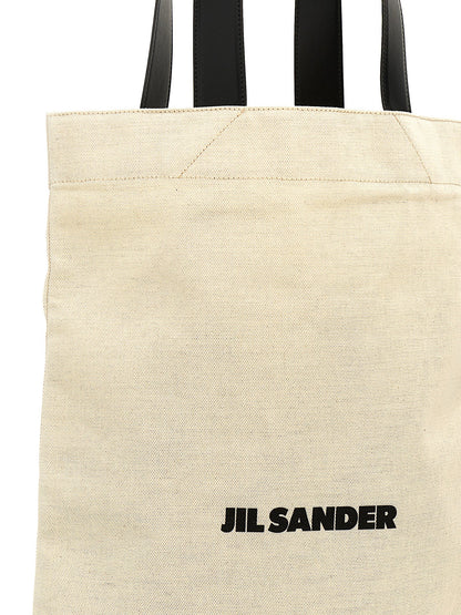 Large Shopper Tote Bag by Jil Sander for women in linen poly cotton canvas & leather bicolour, black, white & print features an sumptuous City Linen Poly Cotton Canvas & Leather Large Shopper Tote Bag design with a secure , ample , and versatile handle for an sumptuous finish.