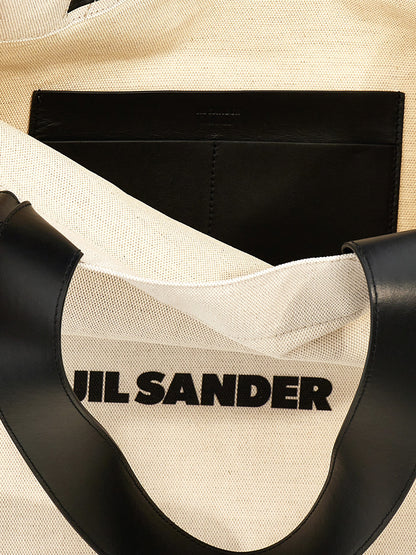 Large Shopper Tote Bag by Jil Sander for women in linen poly cotton canvas & leather bicolour, black, white & print features an utilitarian-chic silhouette, showcasing the City Linen Poly Cotton Canvas & Leather Large Shopper Tote Bag design with a secure , ample , and versatile handle.