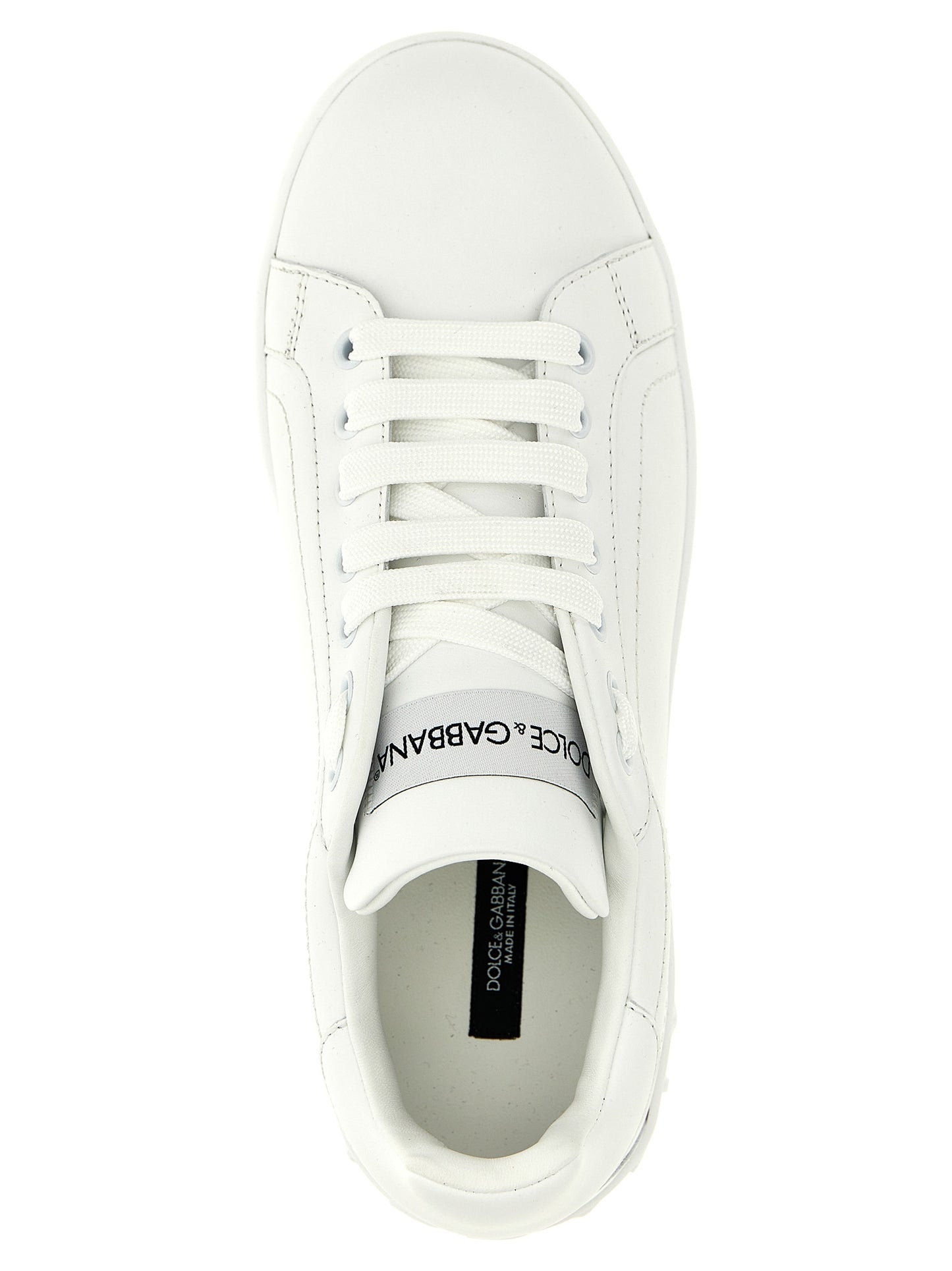 Sneakers by Dolce & Gabbana for women in calfskin leather white presents a sumptuous silhouette, artfully capturing the essence of the Women's Low Top Calfskin Leather Sneakers with its sumptuous low-top style design.