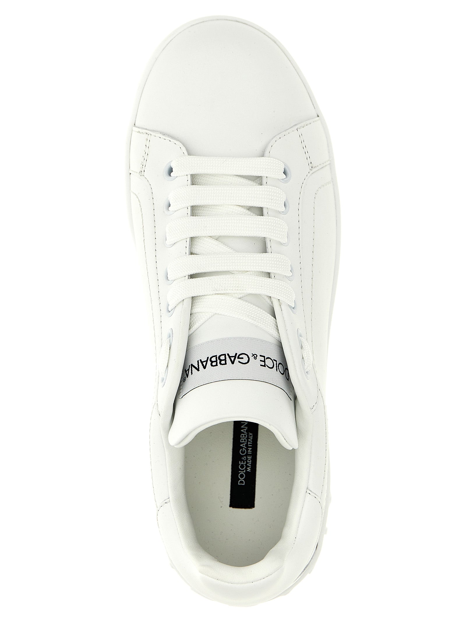 Sneakers by Dolce & Gabbana for women in calfskin leather white presents a sumptuous silhouette, artfully capturing the essence of the Women's Low Top Calfskin Leather Sneakers with its sumptuous low-top style design.