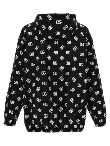 Hooded Windbreaker Jacket by Dolce & Gabbana for men in nylon & polyester bicolour, black, white & print features an magnificent silhouette, showcasing the sophisticated hooded neckline and functional pockets, hooded & windproof for a premium, magnificent look.
