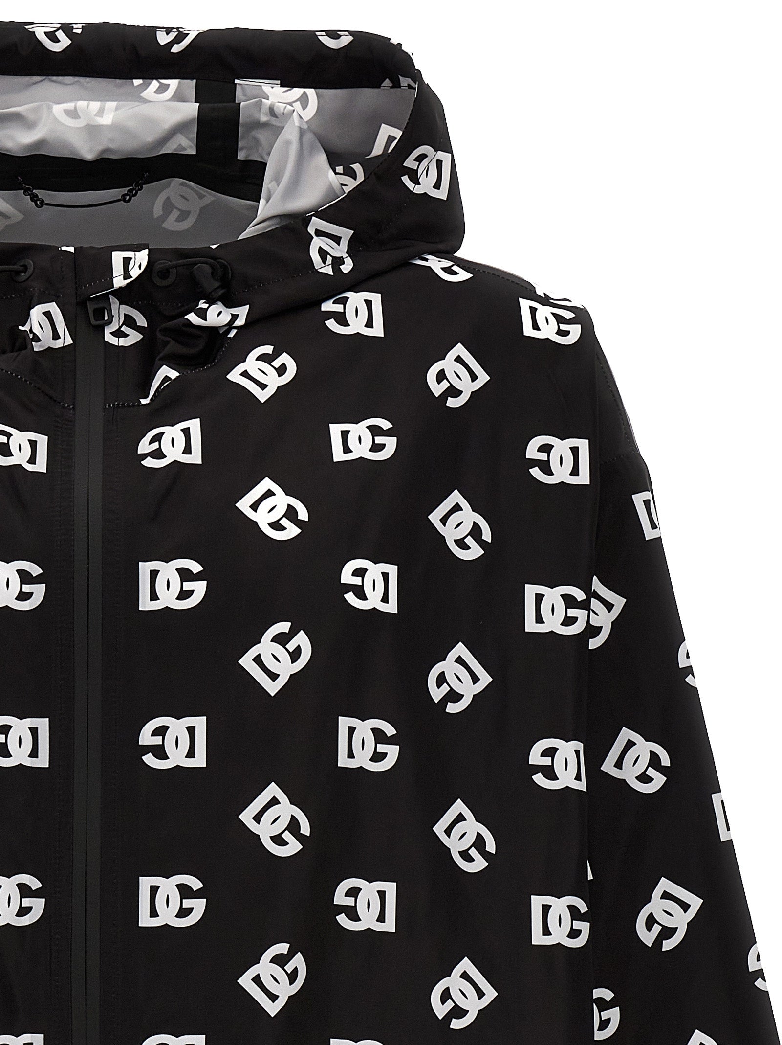 Hooded Windbreaker Jacket by Dolce & Gabbana for men in nylon & polyester bicolour, black, white & print showcases a modern silhouette, integrating pockets, hooded & windproof and a modern hooded neckline for a sophisticated finish.