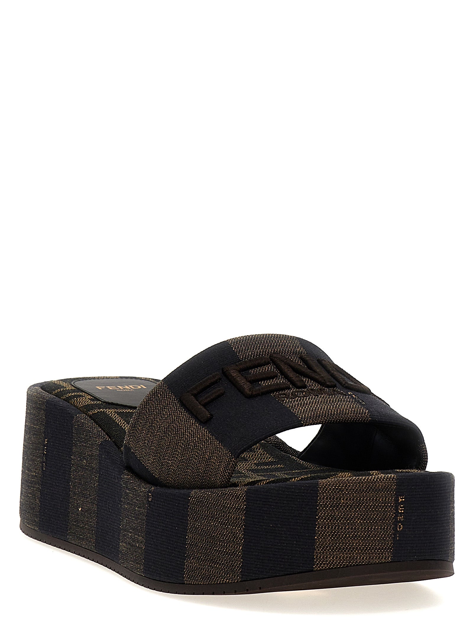 Sliders Sandals Flat Shoes by Fendi for women in cotton brown & striped presents a effortless chic silhouette, showcasing the Women's Cotton Sliders Sandals Flat Shoes design with a effortless chic and for a sophisticated look.