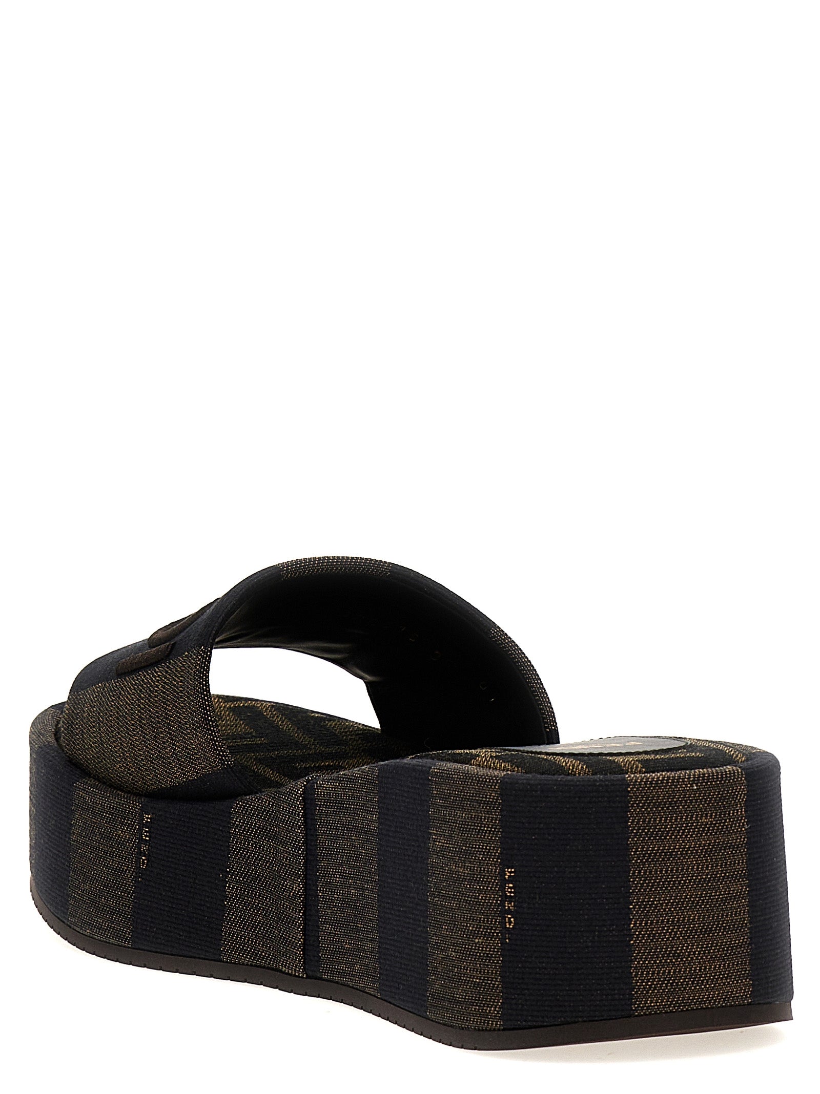 Sliders Sandals Flat Shoes by Fendi for women in cotton brown & striped showcases a enchanting silhouette as part of the Women's Cotton Sliders Sandals Flat Shoes collection, defined by a enchanting and for a enchanting look.