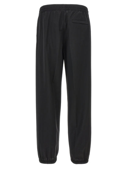 Trousers by Givenchy for men in virgin wool black features an on trend silhouette, showcasing a sophisticated with a long and for an on trend finish.