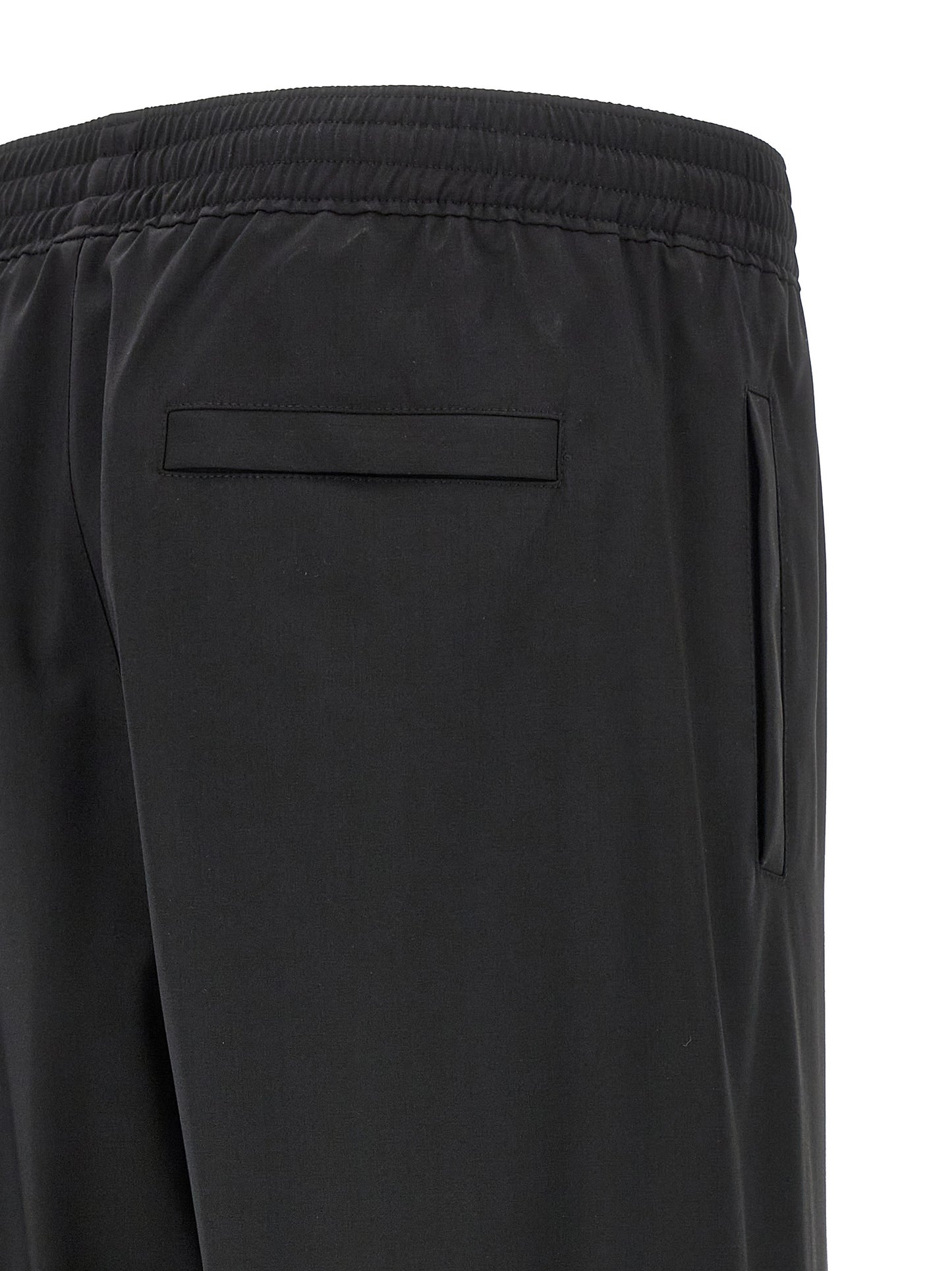 Trousers by Givenchy for men in virgin wool black features a artisanal silhouette, showcasing a sophisticated with a long and for a artisanal finish.