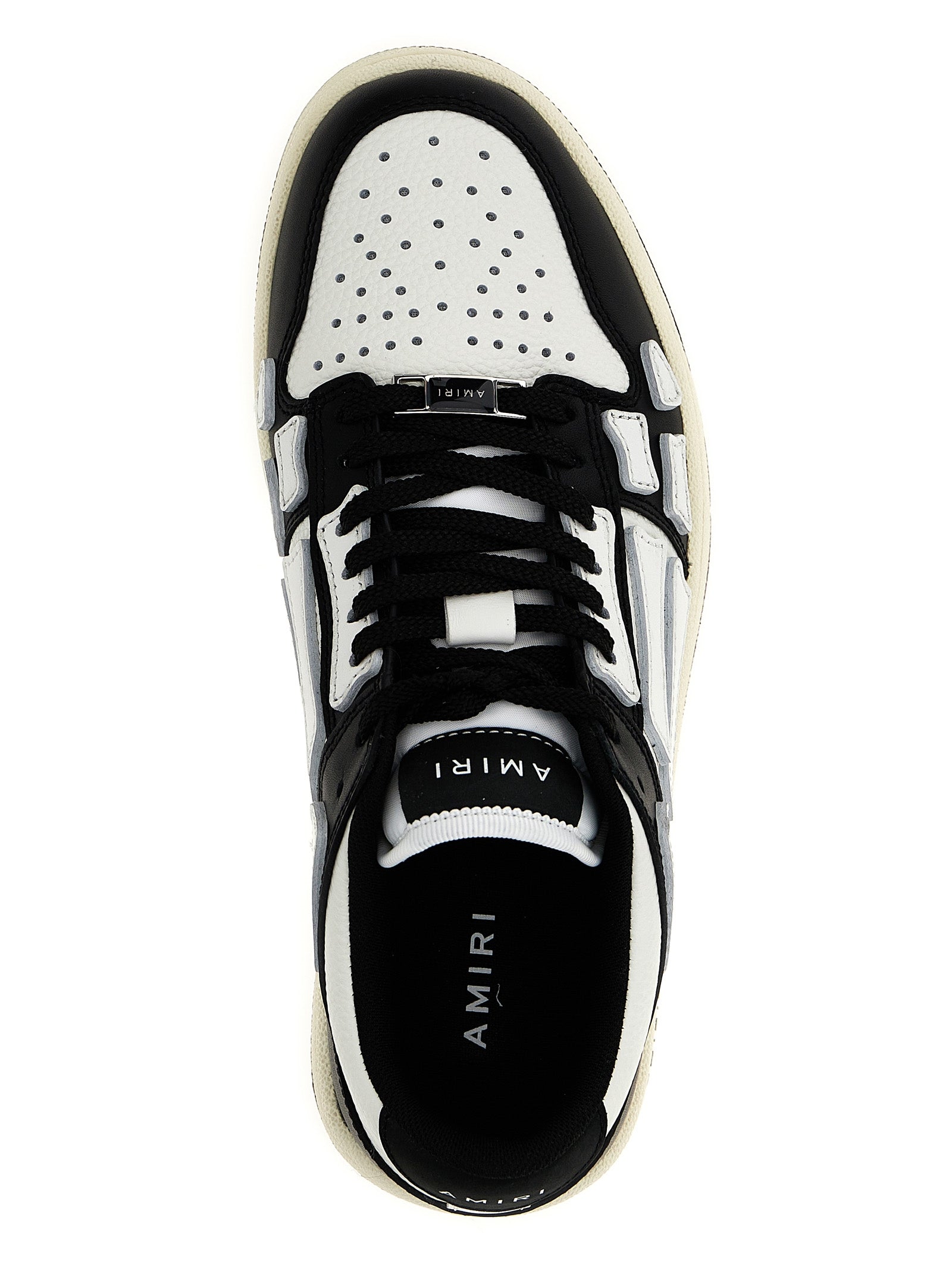 Sneakers by Amiri for women in leather & rubber bicolour, black & white presents a impeccable silhouette as Women's Low Top Leather & Rubber Sneakers, expertly defined by a impeccable low-top style for a impeccable, high-fashion look.
