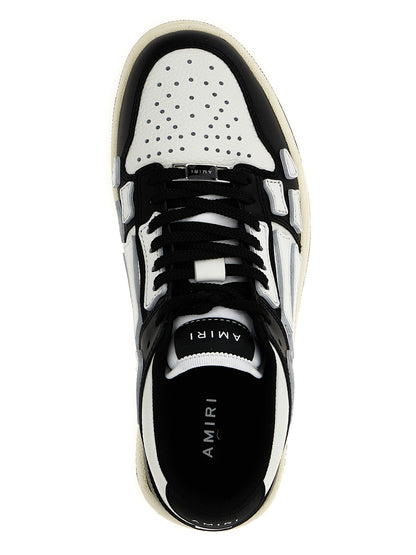 Sneakers by Amiri for women in leather & rubber bicolour, black & white presents a impeccable silhouette as Women's Low Top Leather & Rubber Sneakers, expertly defined by a impeccable low-top style for a impeccable, high-fashion look.